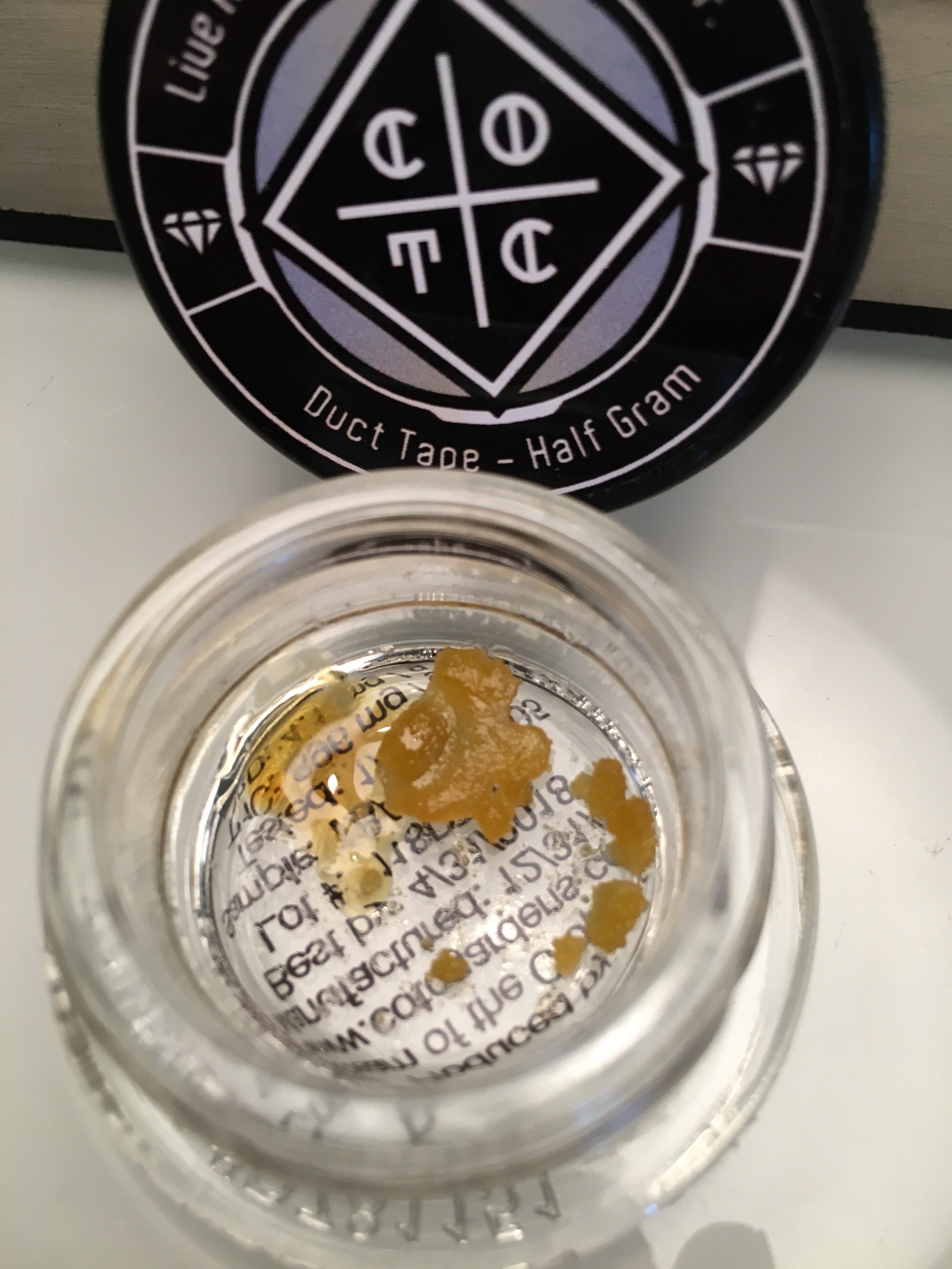 Cream of the Crop live resin in a bottle